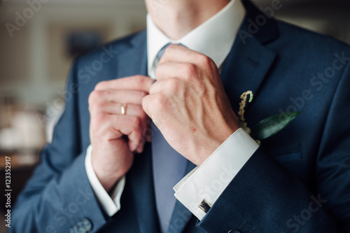 Fashion detail image of a groom wearing