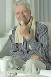 elderly man with flu inhalation