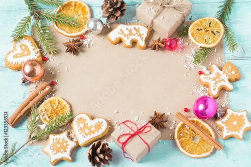 Background gifts, Christmas cookies and oranges on a blue backgr