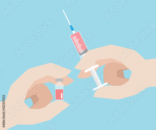 hand with syringe and vaccine bottle