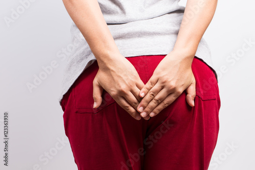 Woman has diarrhea and holding her butt © chajamp