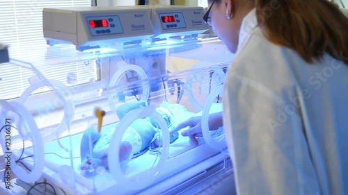 premature baby in an incubator photo