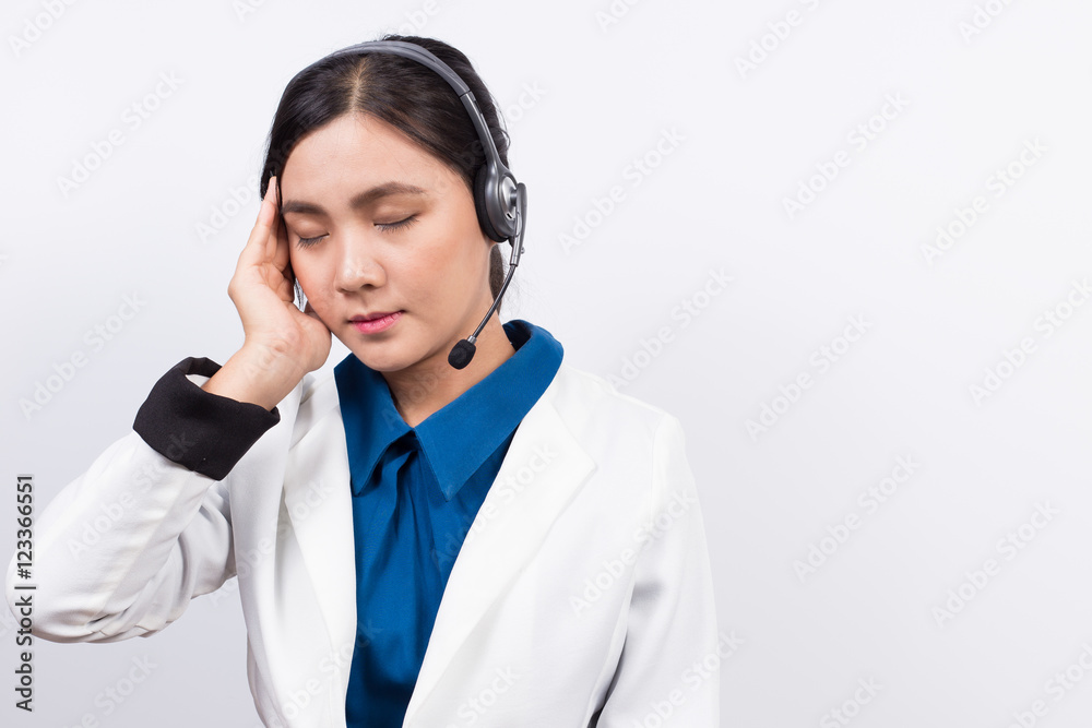 Operator or businesswoman in headset and she has headache Operator or businesswoman in headset and she has headache