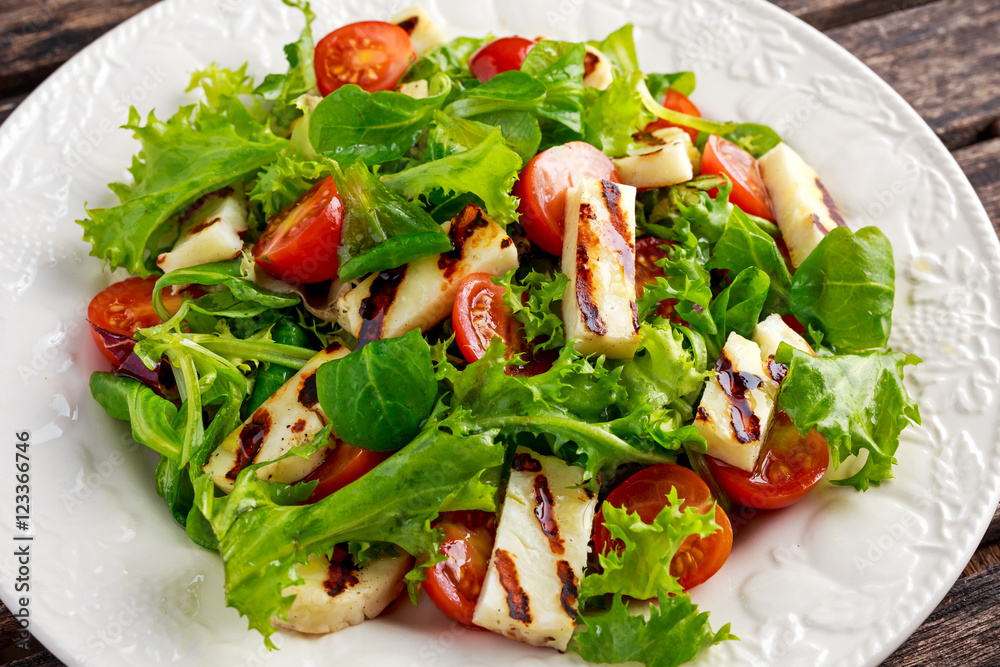 Grilled Halloumi Cheese salad witch tomatoes and lettuce. healthy food Grilled Halloumi Cheese salad witch tomatoes and lettuce. healthy food