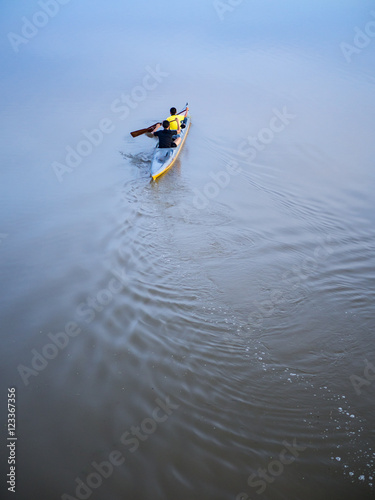 The boy in the kayak,river