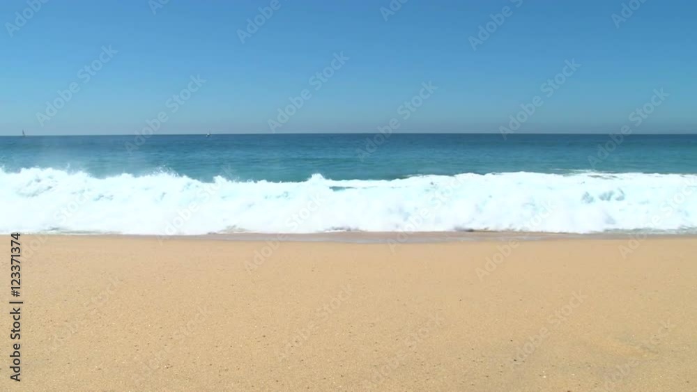 Ocean seascape scenic off Cabo San Lucas, Mexico with large wave crashing on sandy shore. Ocean seascape scenic off Cabo San Lucas, Mexico with large wave crashing on sandy shore.