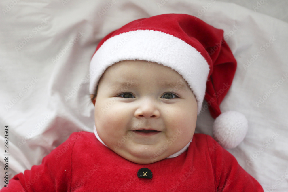 portrait of a baby with a Santa Claus costume portrait of a baby with a Santa Claus costume