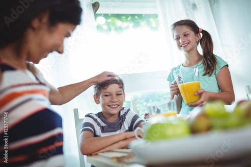 Smiling family having a breakfast