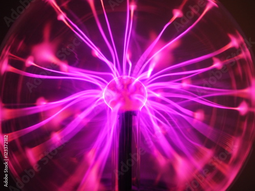 Purple and pink Plasma filaments in plasma globe or ball