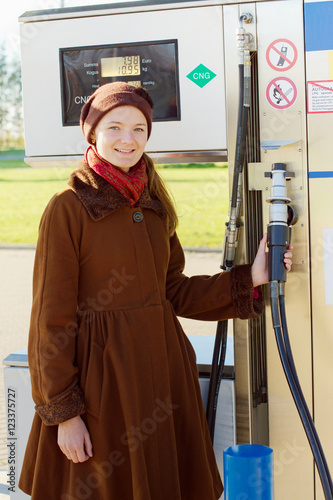 woman takes gun for refueling natural gas car