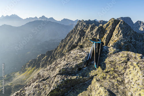 Trekking poles in the mountains. © gubernat