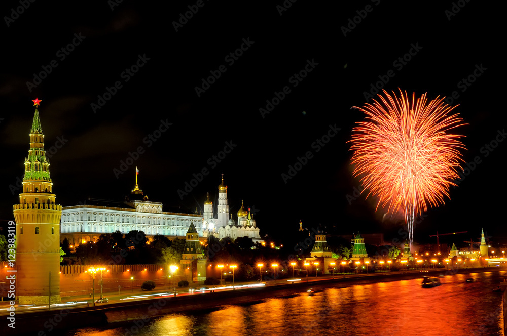 Flashes of orange and white fireworks near Moscow Kremlin