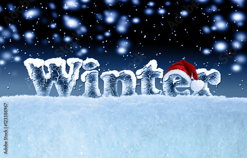Obraz na płótnie winter background with ice text and santa cap w salonie