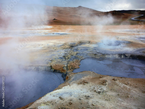 Geothermal hot springs natural area with steaming sulfur pools and vibrant color