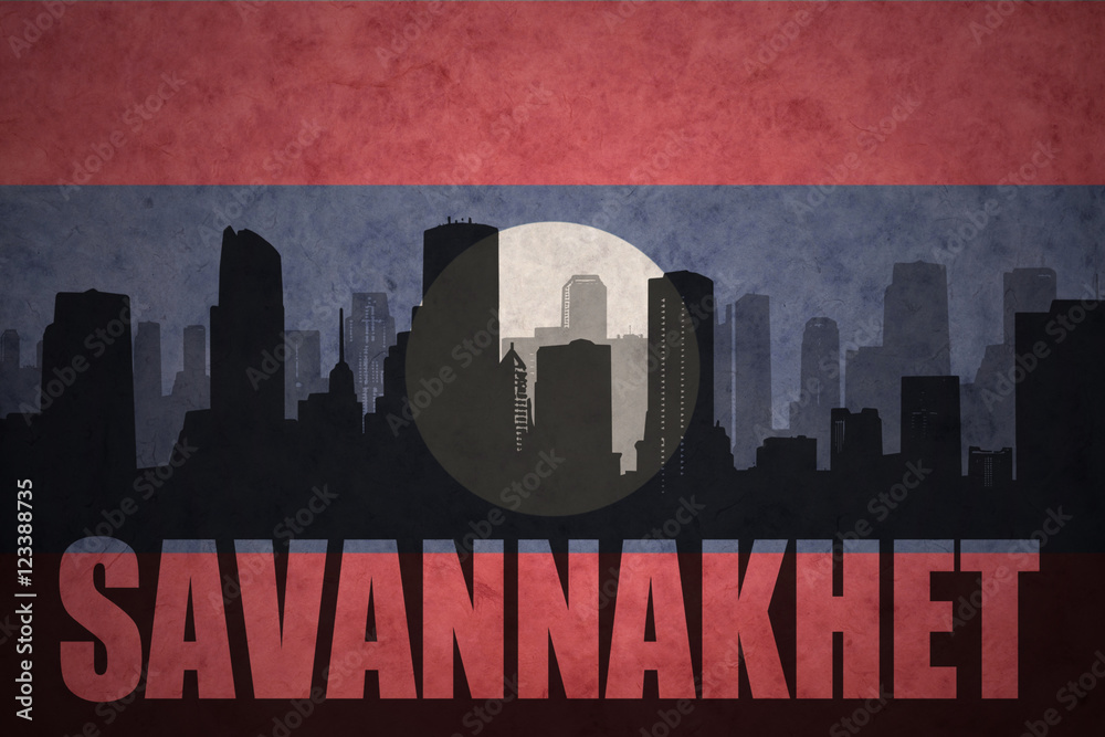 abstract silhouette of the city with text Savannakhet at the vintage laotian flag background