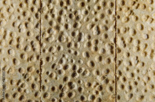 Crispy bread texture with holes chaotic pattern 