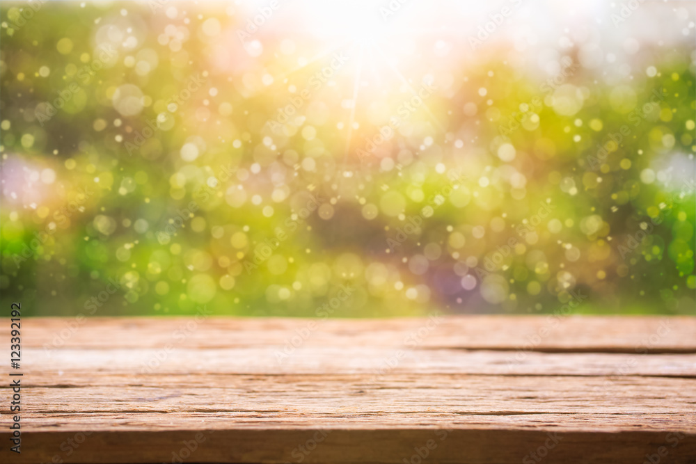 Wooden table with green background