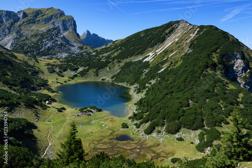 Mountains landscape with a little lake. Austria  Tyrol  Lake Zirein.