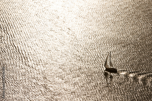 A lone sailboat on Utah Lake