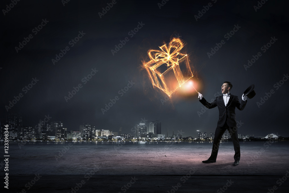 Businessman demonstrating magic . Mixed media Businessman demonstrating magic . Mixed media