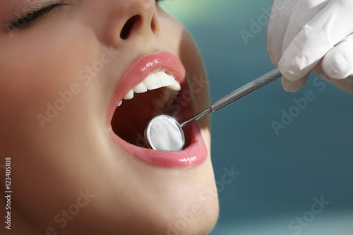 Young woman visiting dentist for dental checkup