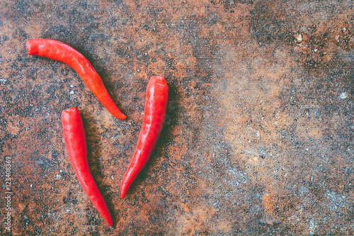 Red hot chili pepper on stone background