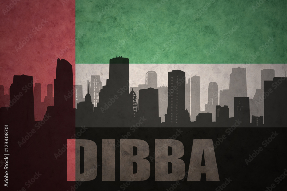 abstract silhouette of the city with text Dibba at the vintage united arab emirates flag background