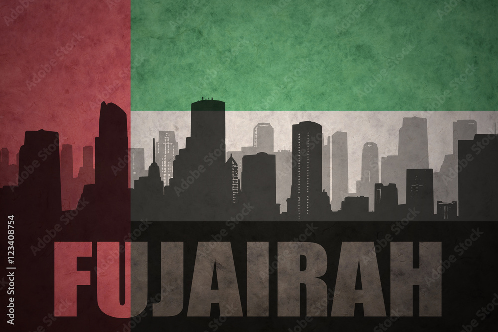 abstract silhouette of the city with text Fujairah at the vintage united arab emirates flag background