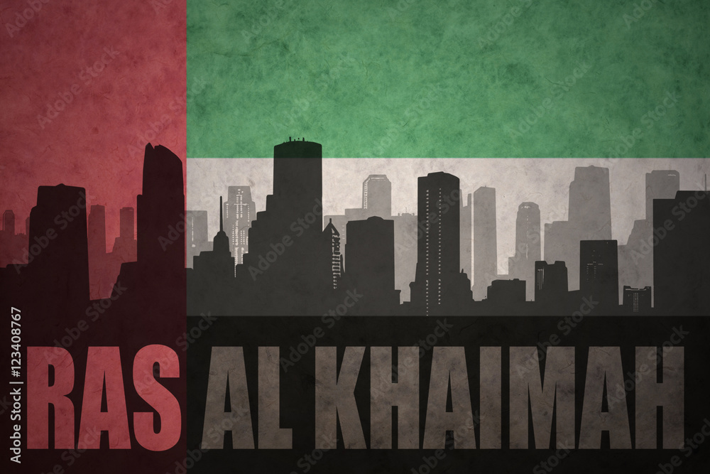 abstract silhouette of the city with text Ras Al Khaimah at the vintage united arab emirates flag background