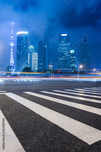Empty asphalt road through modern city in Shanghai China.
