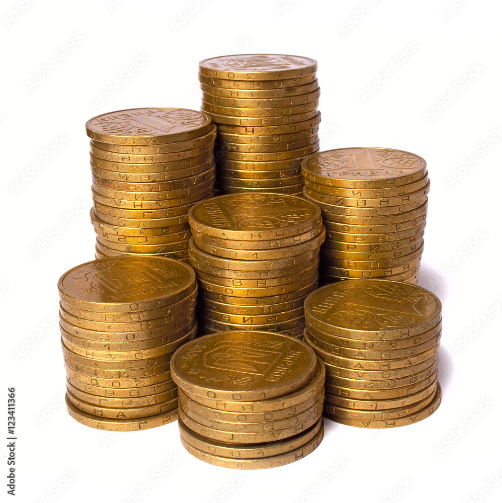 piles of gold coins isolated on white background, close up view piles of gold coins isolated on white background, close up view