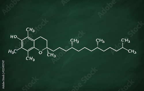Structural model of Vitamin E (tocopherol) on the blackboard.