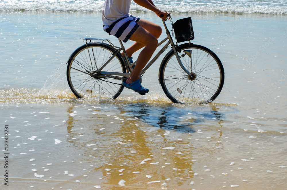 Fototapeta premium Bike ride on the beach