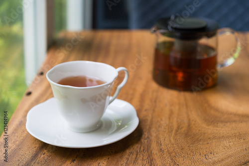 Obraz na płótnie Cup of tea on wooden table. shallow depth of field w salonie