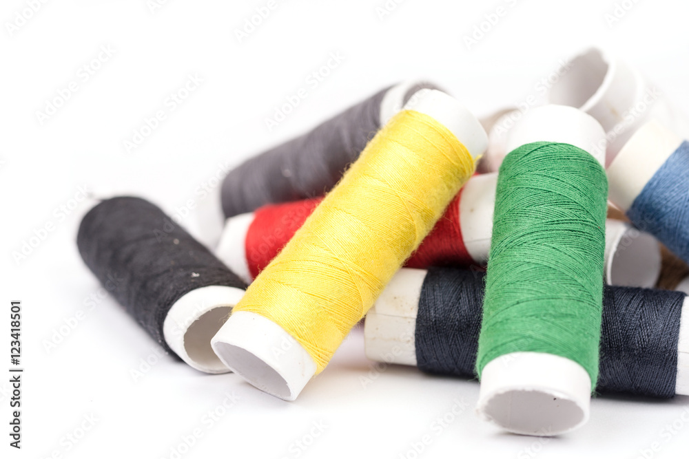 Pile of colorful threads over white background Pile of colorful threads over white background