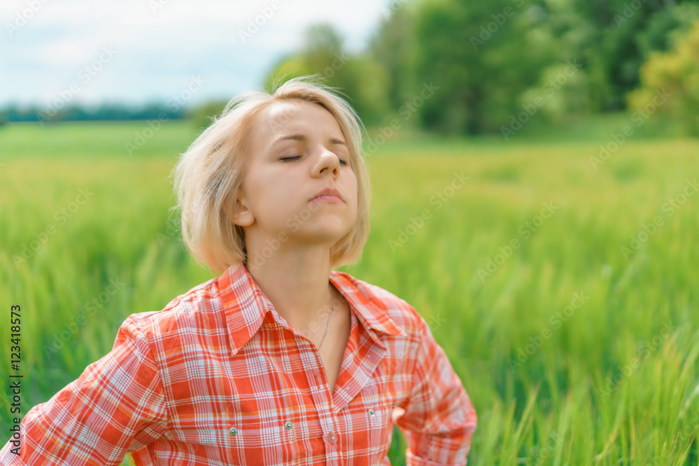Portrait of beautiful girl in green field Portrait of beautiful girl in green field