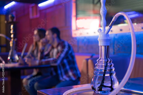 Young couple in a hookah bar.
