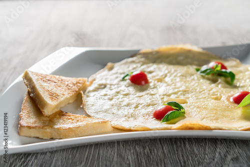 English Omelette with Tomatoes on Table