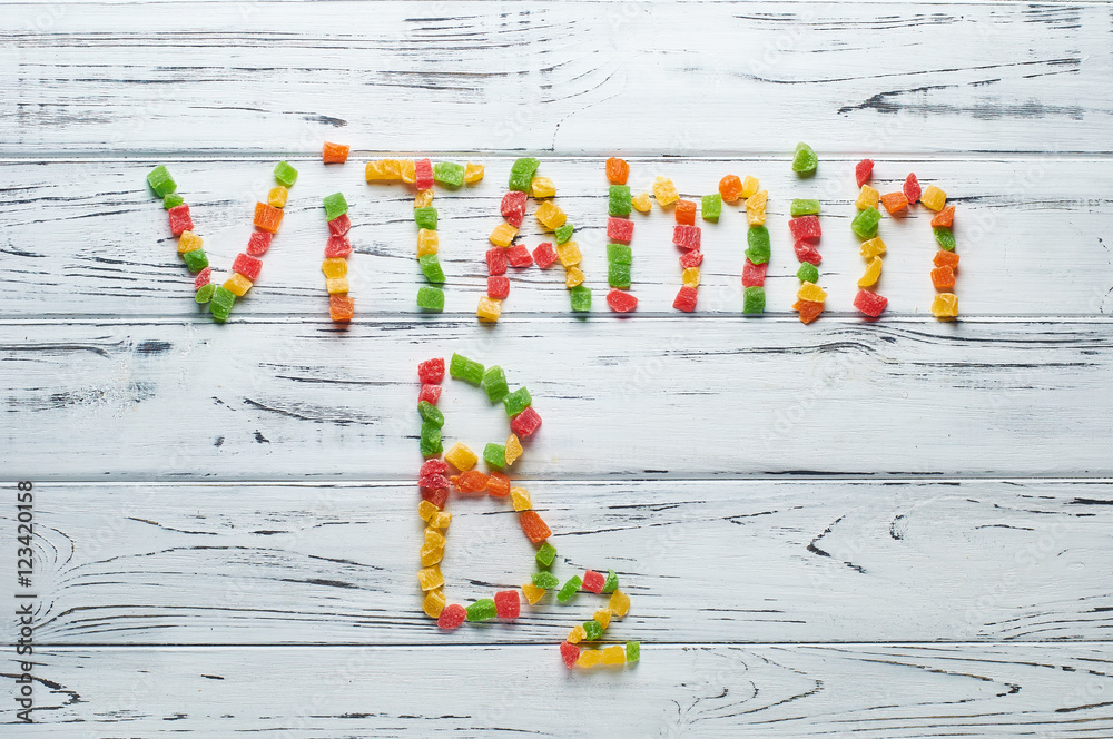 Ταπετσαρία From pieces of colored candied fruits laid out the word vitamin B2