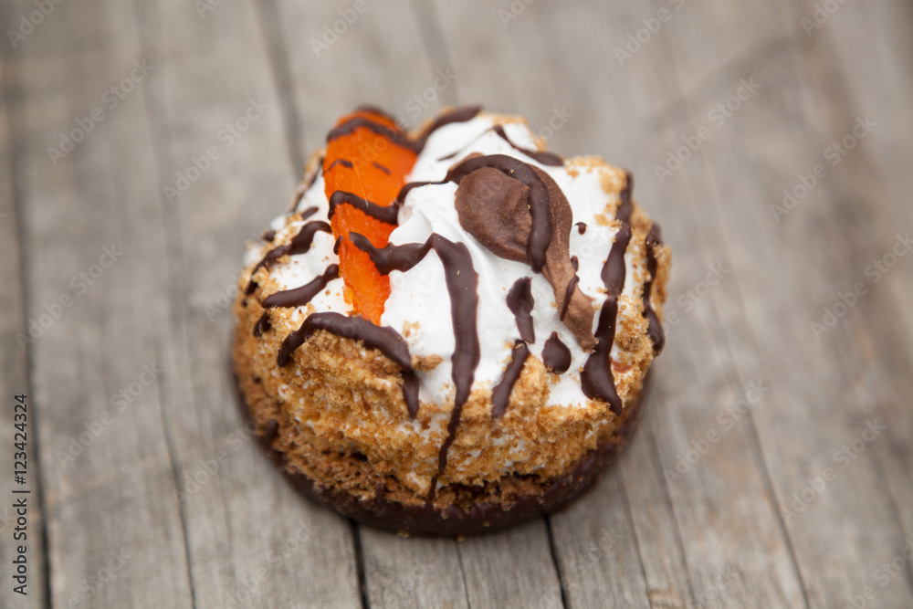sweet autumn cake on wooden board
