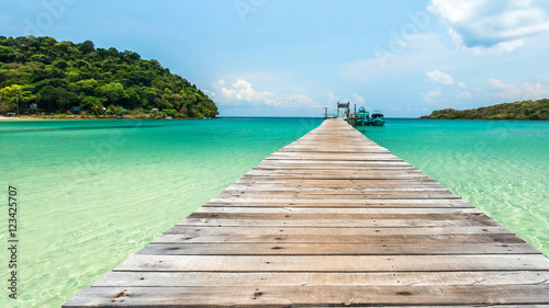 Old wooden bridge with beautiful turquoise sea