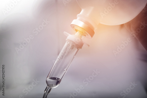 Close up saline IV drip for patient and Infusion pump in hospita