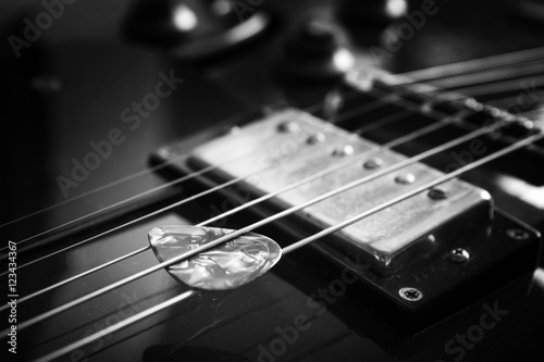 Acoustic guitar close up in dark background