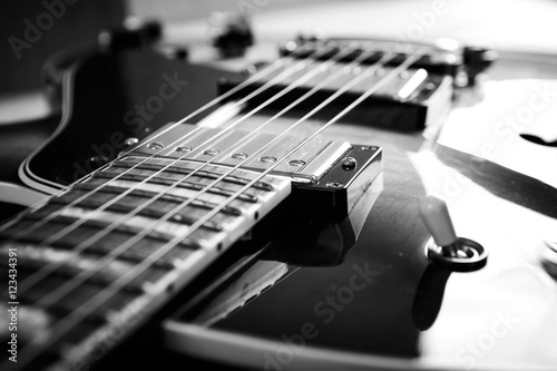 Acoustic guitar close up in dark background