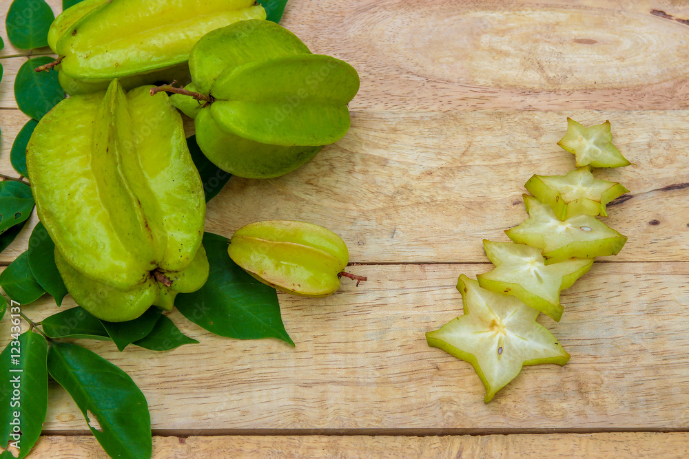Star fruit on wood background ,starfruit on wooden background Star fruit on wood background ,starfruit on wooden background