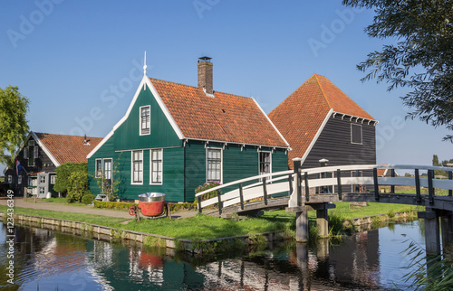 Traditional dutch wooden house and white bridge in Zaanse Schans
