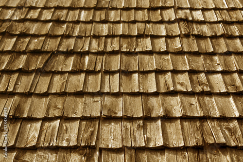 Weathered wooden tile roof texture.