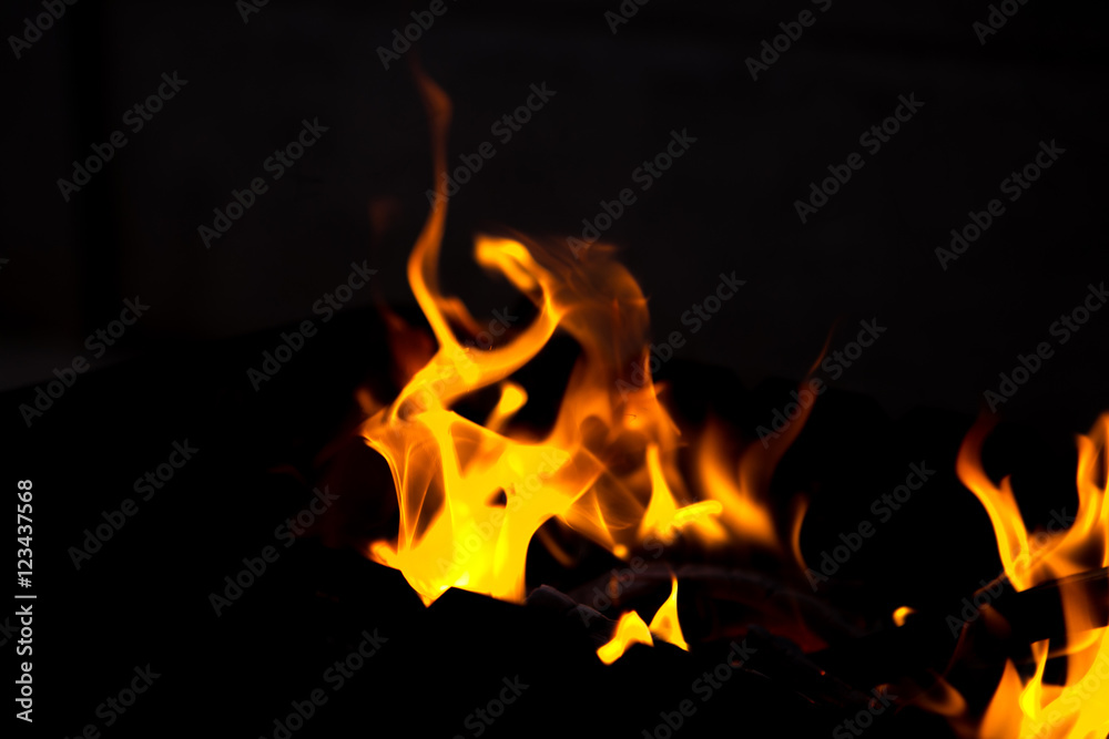 fire flames with sparks on a black background fire flames with sparks on a black background