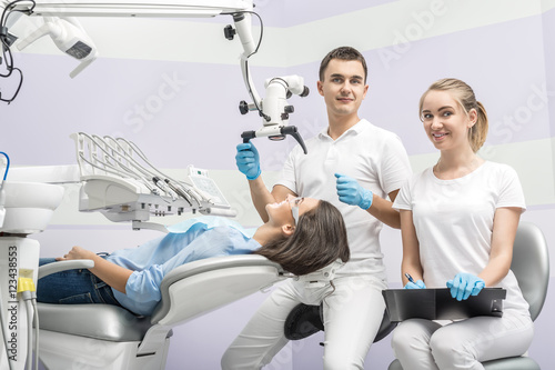 Dentist  assistant and patient in clinic