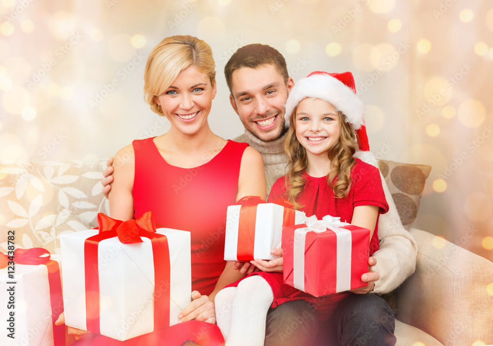 smiling family holding many gift boxes smiling family holding many gift boxes